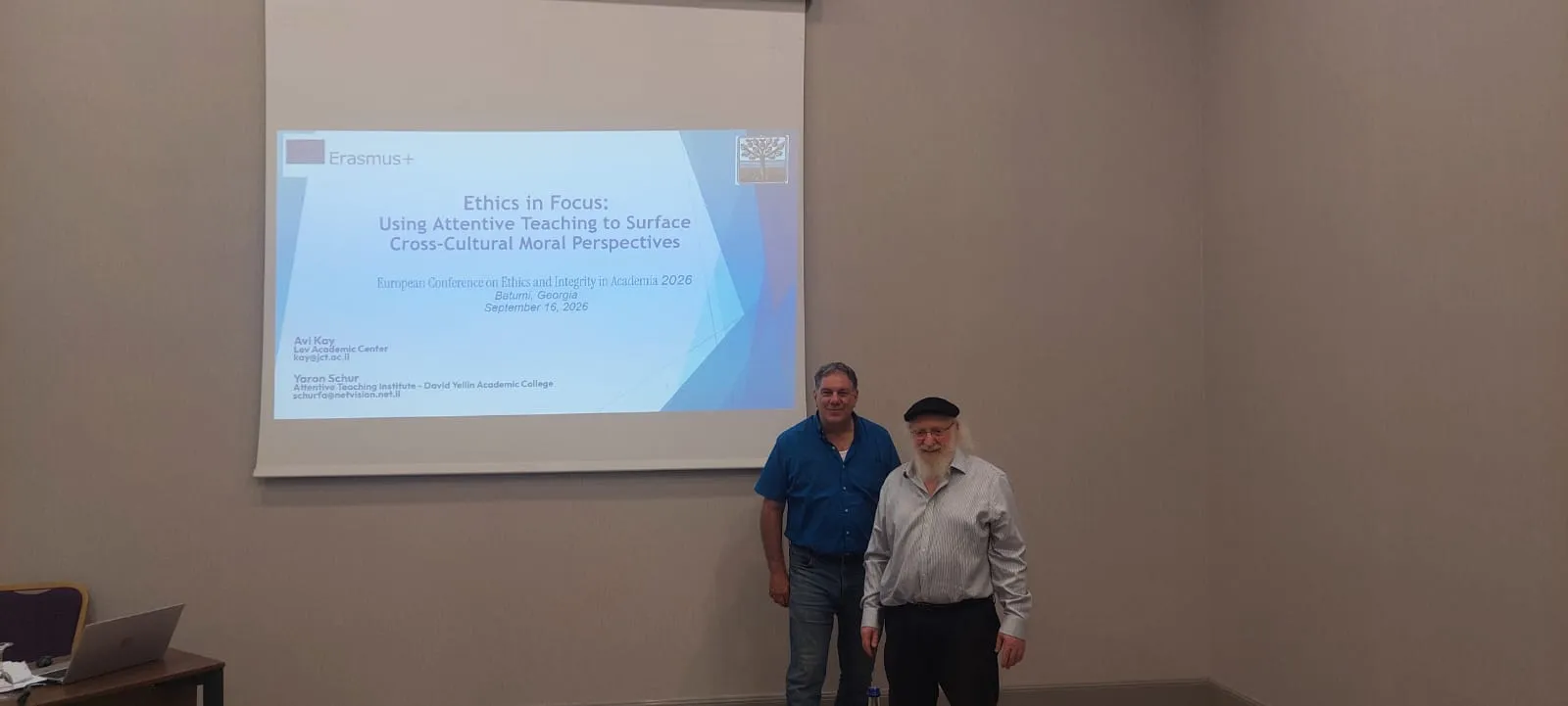 Avi Kay and Yaron Schur in Batumi, in front of the title slide of their presentation